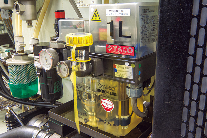 An Azbil TA's mist lubrication unit, incorporated into a machine tool, sprays lubricant on a spindle and bearing.