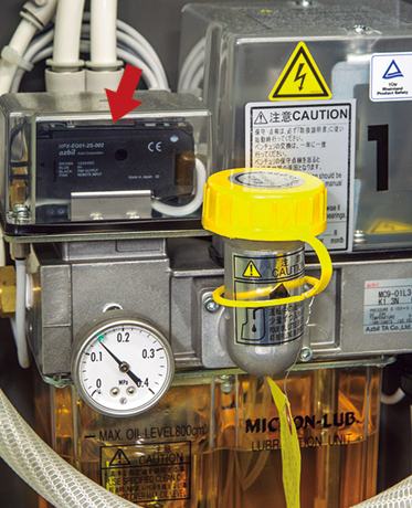 An Azbil Corporation photoelectric sensor monitors oil dropping to the venturi of Azbil TA's mist lubrication unit.