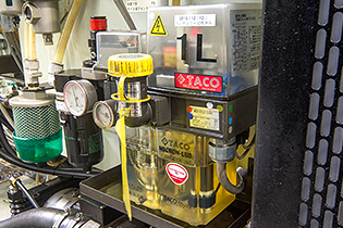 An Azbil TA's mist lubrication unit, incorporated into a machine tool, sprays lubricant on a spindle and bearing.