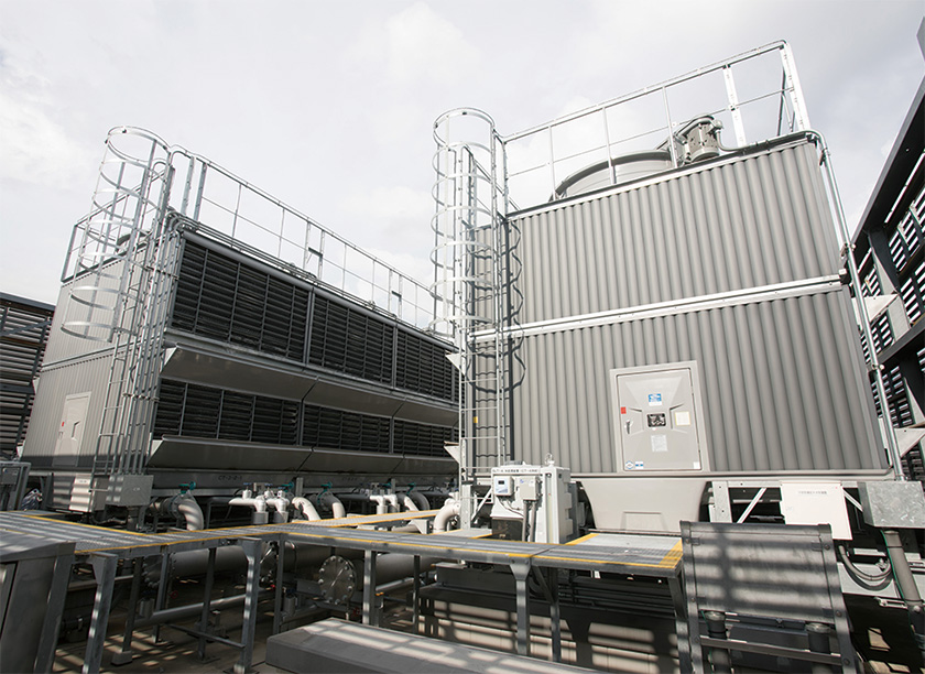 Cooling towers for freezers and refrigerators on the roof of the market.