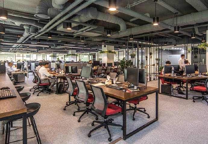In the spacious new office, employees are allowed to freely change desks.